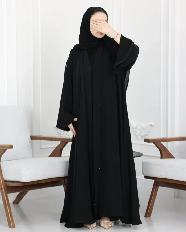 ⁦عباية كلوش بشك اسود محددة⁩ - الصورة ⁦6⁩